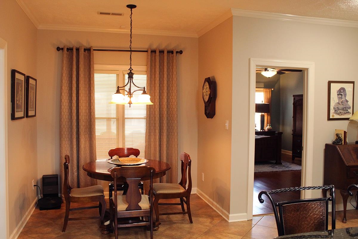175 Windale Drive Jackson, TN 38305 - Photo 18 of 25 Dining area featuring ornamental molding, suspended lighting, and a ceiling fan