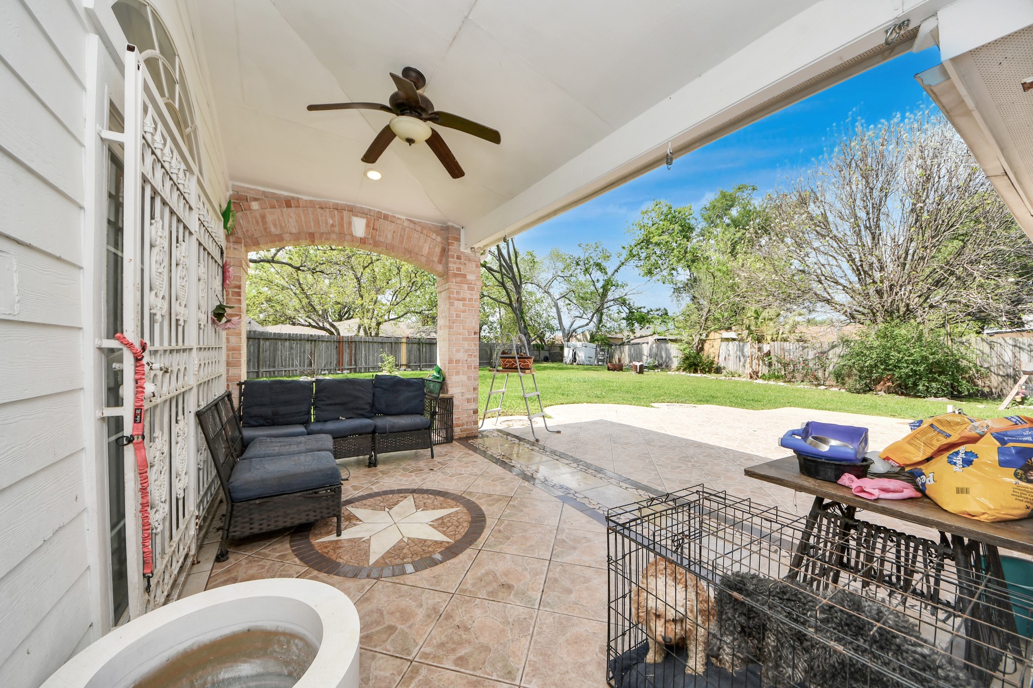 1359 Littleport Lane Channelview, TX 77530 - Photo 24 of 32 a view of a patio with a table chairs and a backyard
