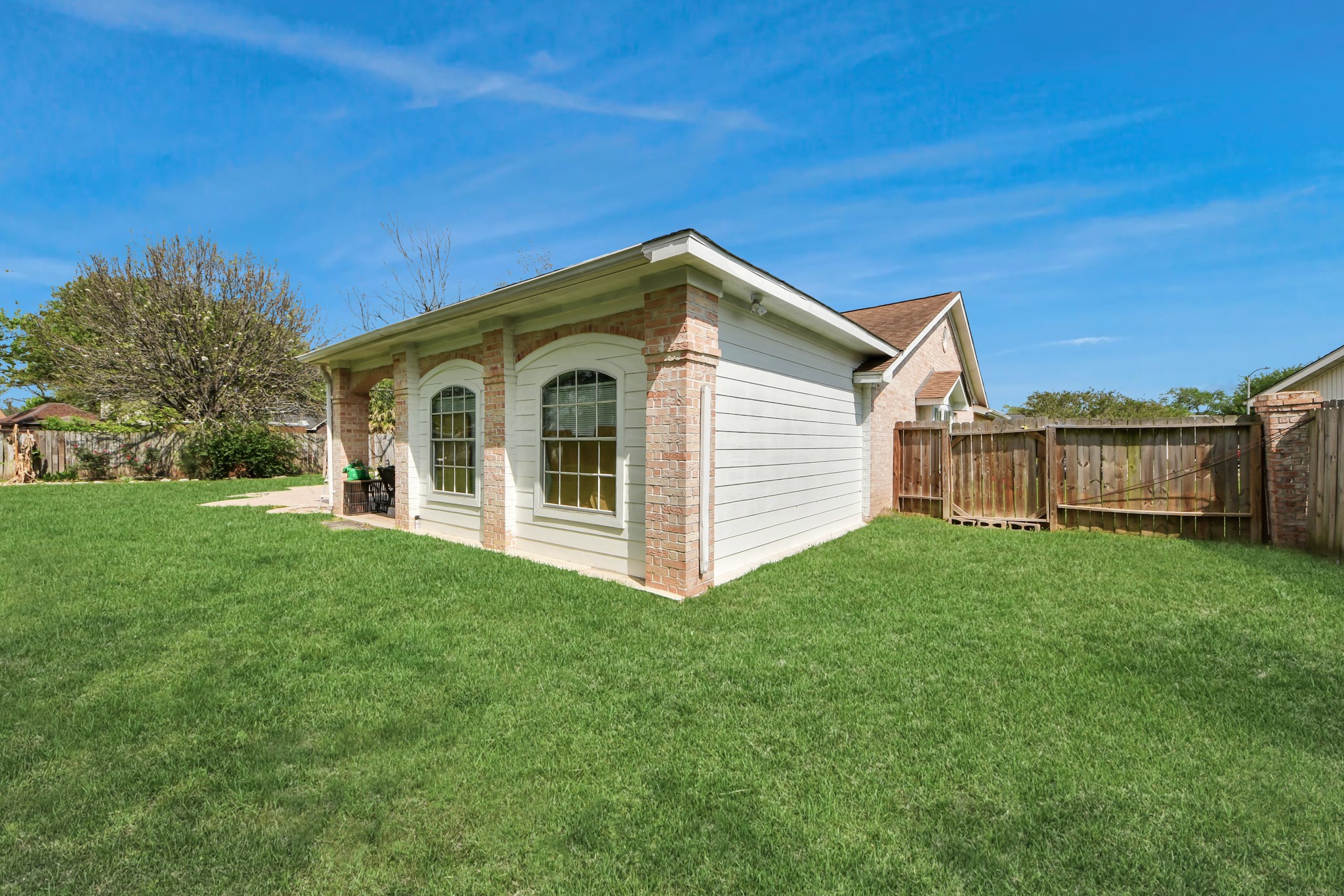 1359 Littleport Lane Channelview, TX 77530 - Photo 32 of 32 a view of a house with a yard