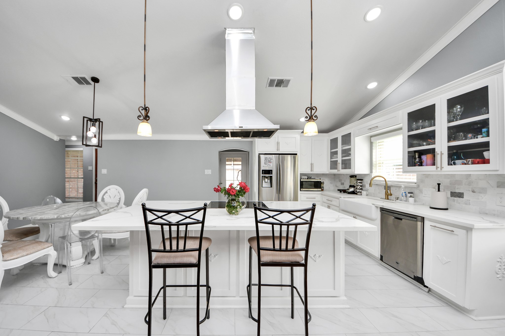 1359 Littleport Lane Channelview, TX 77530 - Photo 6 of 32 a kitchen with stainless steel appliances kitchen island a dining table and chairs