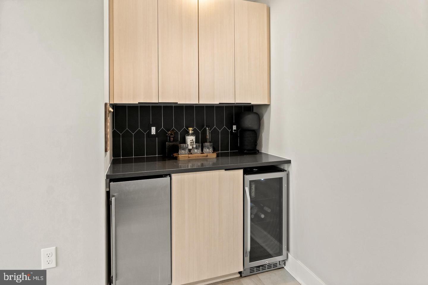 6713 Box Turtle Court New Market, MD 21774 - Photo 11 of 70 Wine fridge and ice maker in main fl bar station.