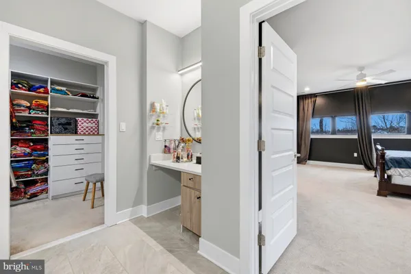 a bedroom with a bed and a desk