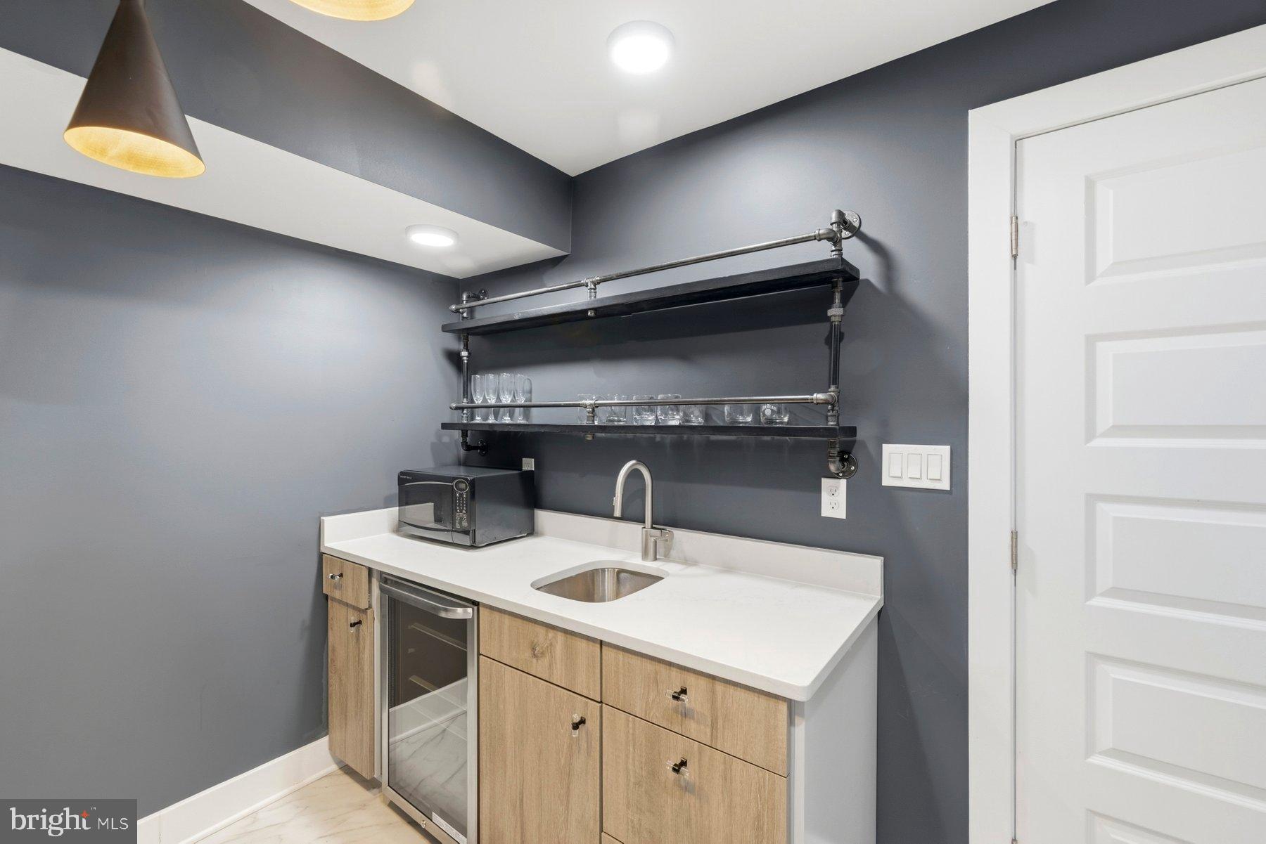 6713 Box Turtle Court New Market, MD 21774 - Photo 53 of 70 Another wine fridge and wet bar.