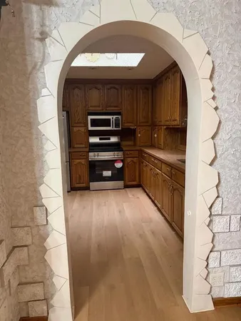 a view of entryway with wooden floor