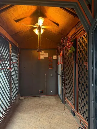 a view of a room that has a large window