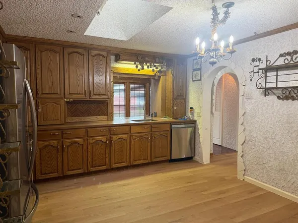 a spacious bathroom with a double vanity sink and a mirror
