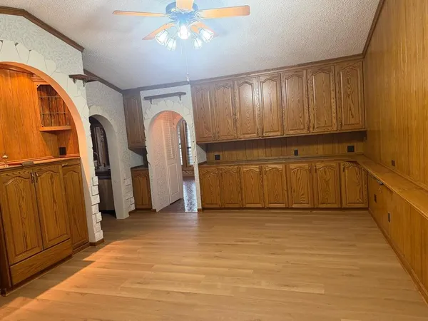 a kitchen with stainless steel appliances granite countertop a refrigerator stove and sink