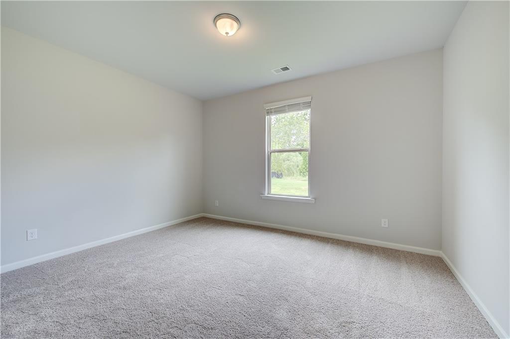 343 Linford Drive Locust Grove, GA 30248 - Photo 18 of 36 an empty room with a window