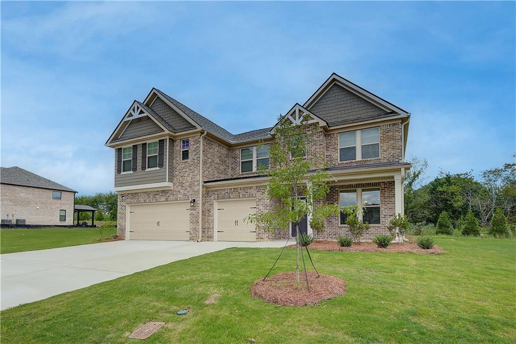 343 Linford Drive Locust Grove, GA 30248 - Photo 2 of 36 a front view of a house with a yard