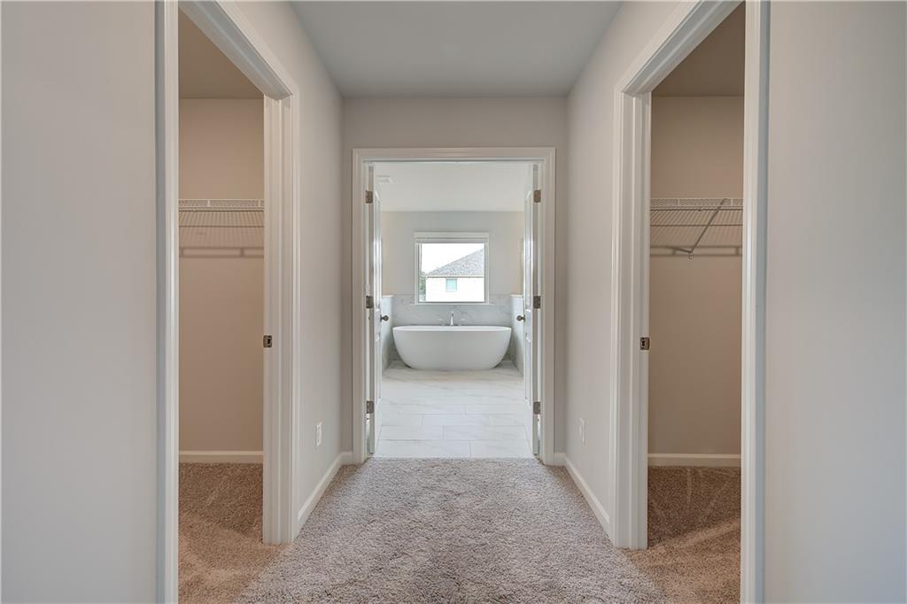 343 Linford Drive Locust Grove, GA 30248 - Photo 28 of 36 a view of a hallway view with three rooms