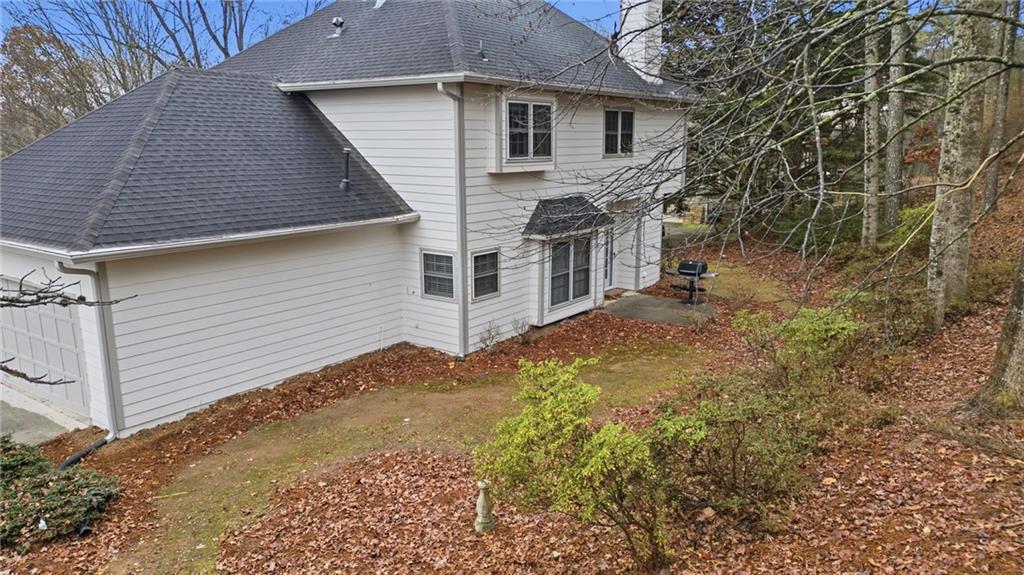 5868 Valine Way Sugar Hill, GA 30518 - Photo 26 of 32 a view of a house with a yard