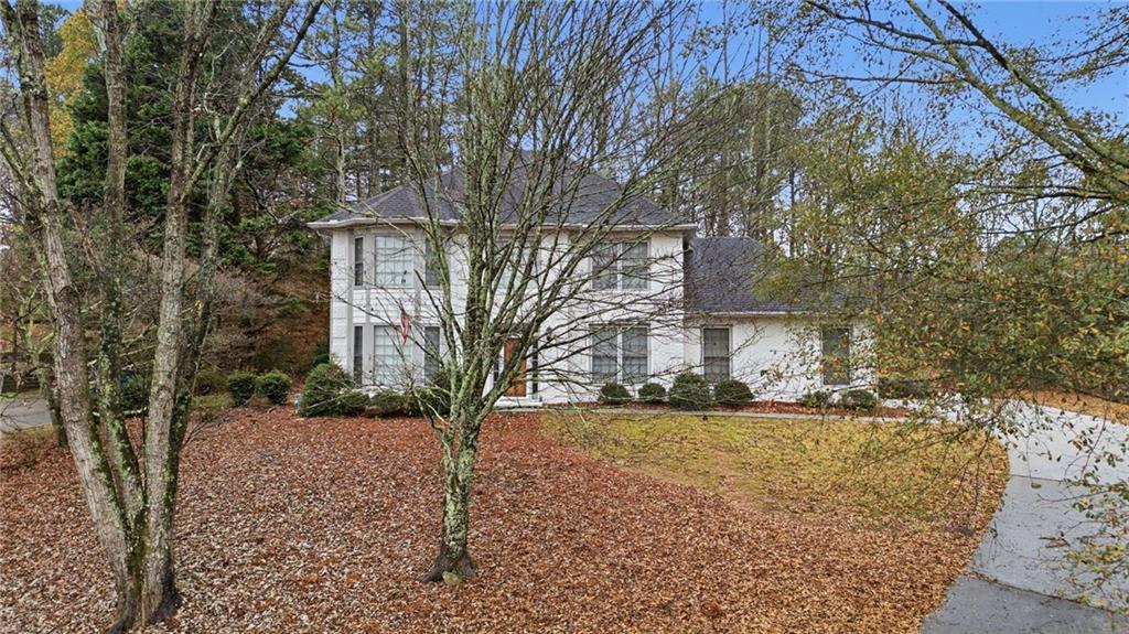 5868 Valine Way Sugar Hill, GA 30518 - Photo 29 of 32 a view of a yard with a house