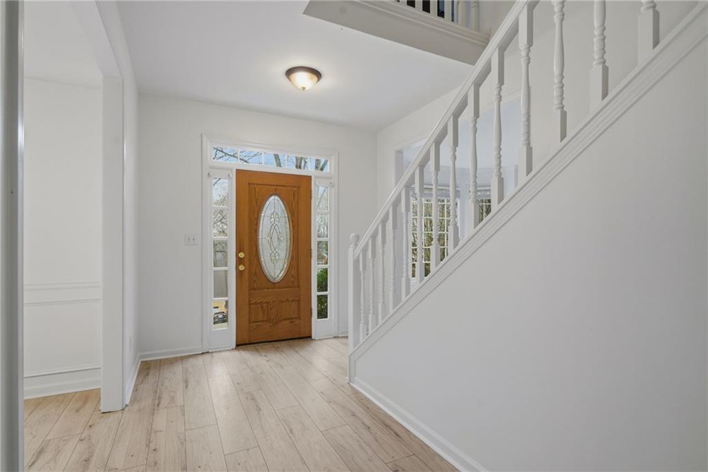 5868 Valine Way Sugar Hill, GA 30518 - Photo 4 of 32 a view of an entryway with wooden floor
