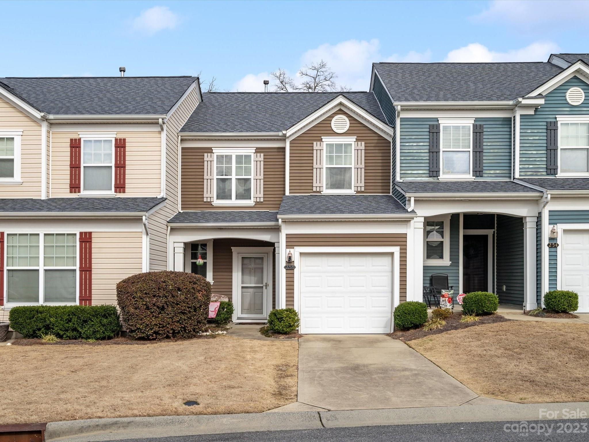 a front view of a house with garage and garage