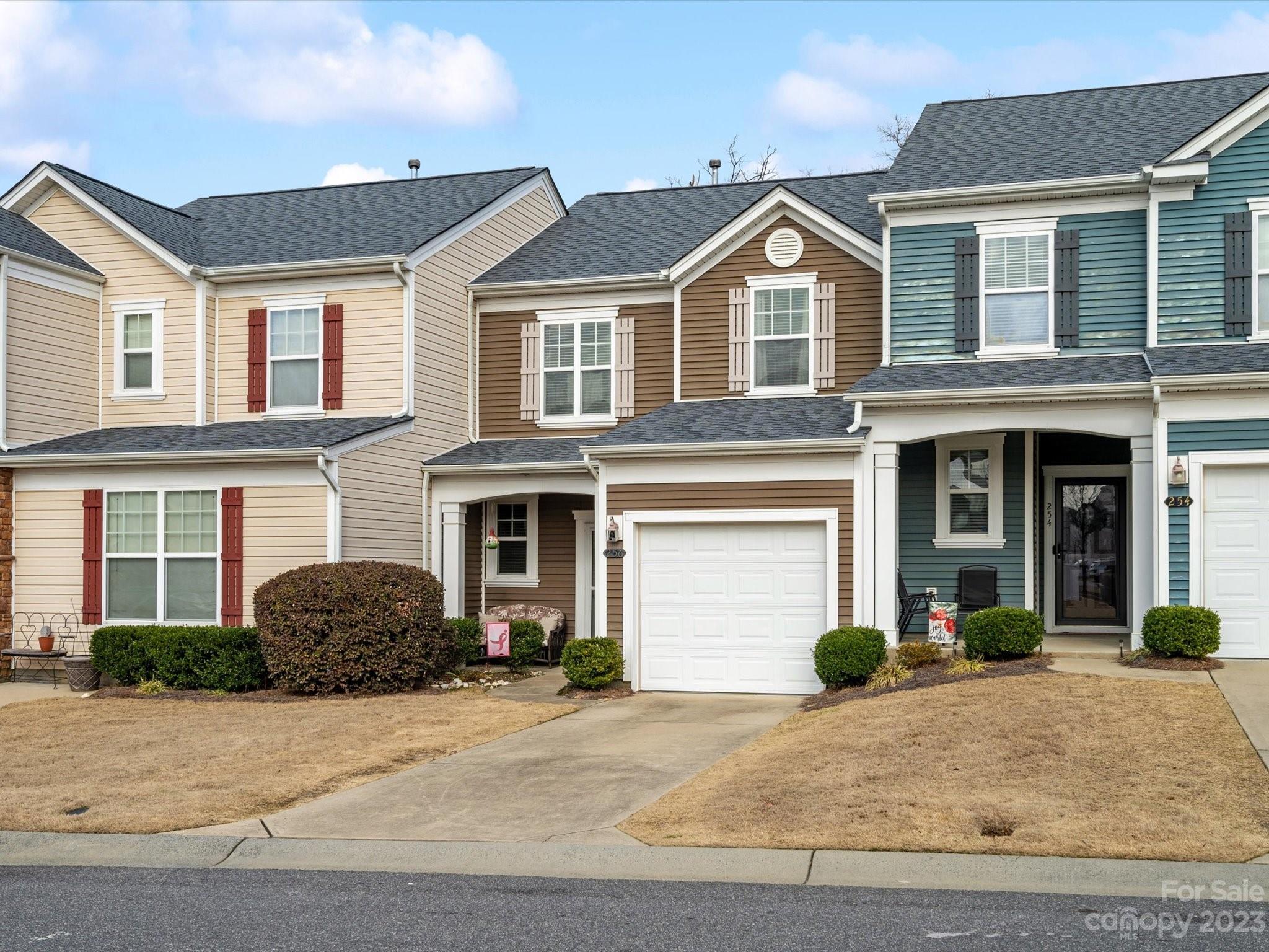 256 River Clay Road Fort Mill, SC 29708 - Photo 2 of 41 a front view of a house with a yard and garage