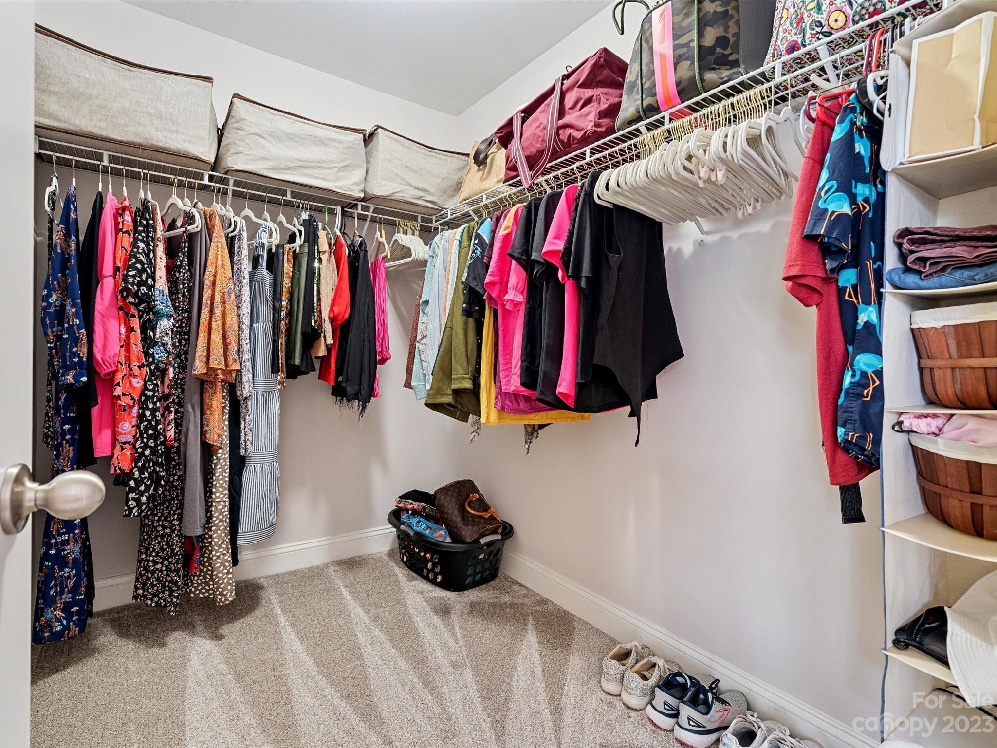 256 River Clay Road Fort Mill, SC 29708 - Photo 23 of 41 a view of walk in closet with clothes and shoes