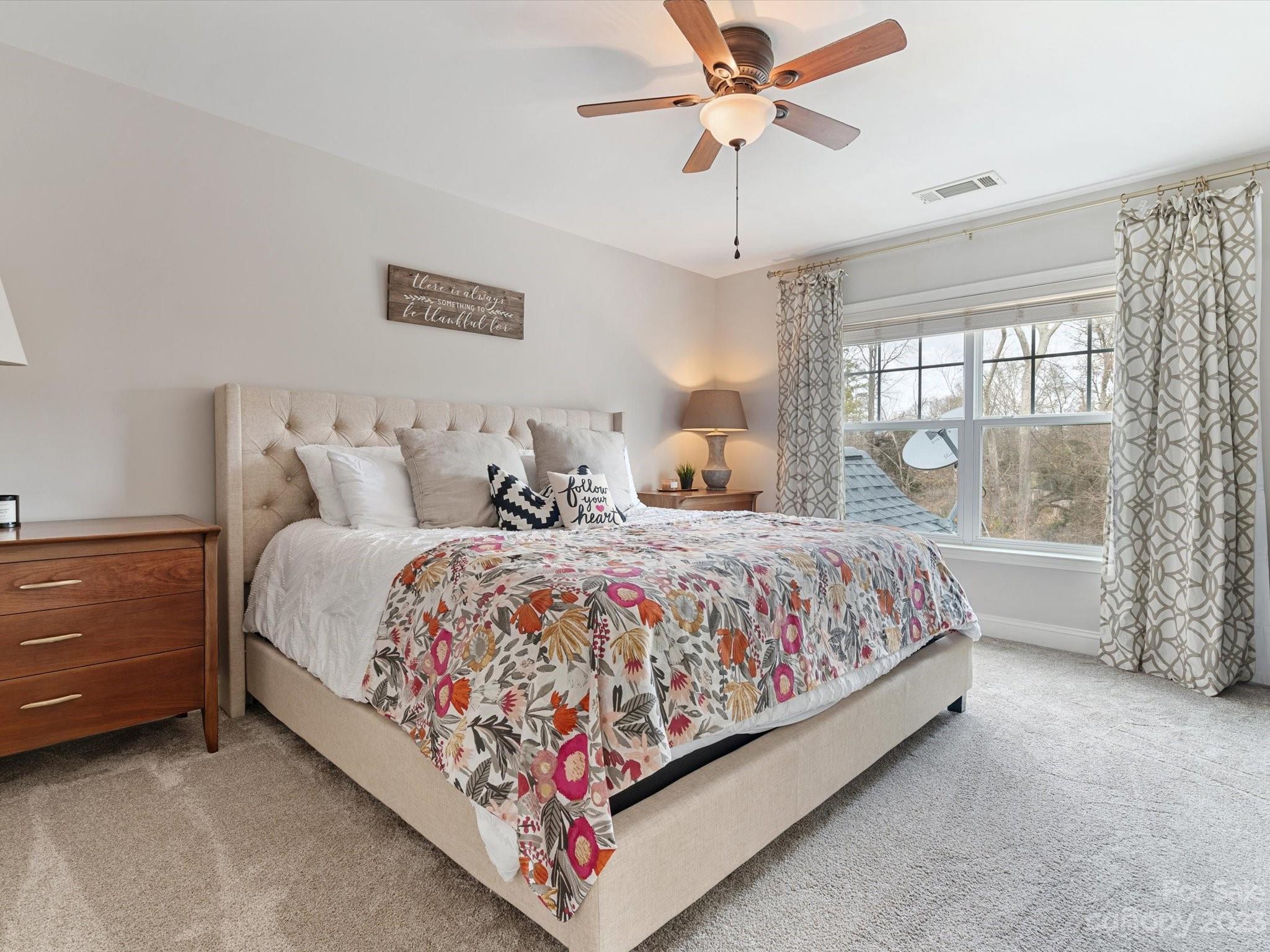 256 River Clay Road Fort Mill, SC 29708 - Photo 24 of 41 a bed sitting in a bedroom next to a window