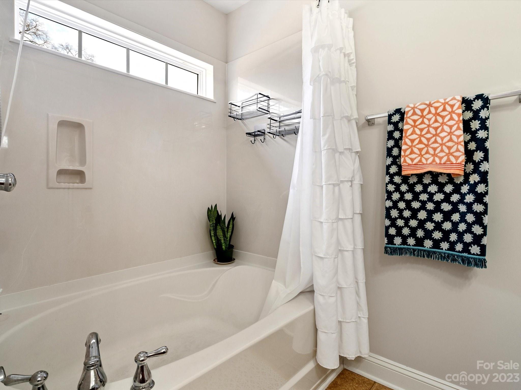 256 River Clay Road Fort Mill, SC 29708 - Photo 28 of 41 a bathroom with a bathtub and shower