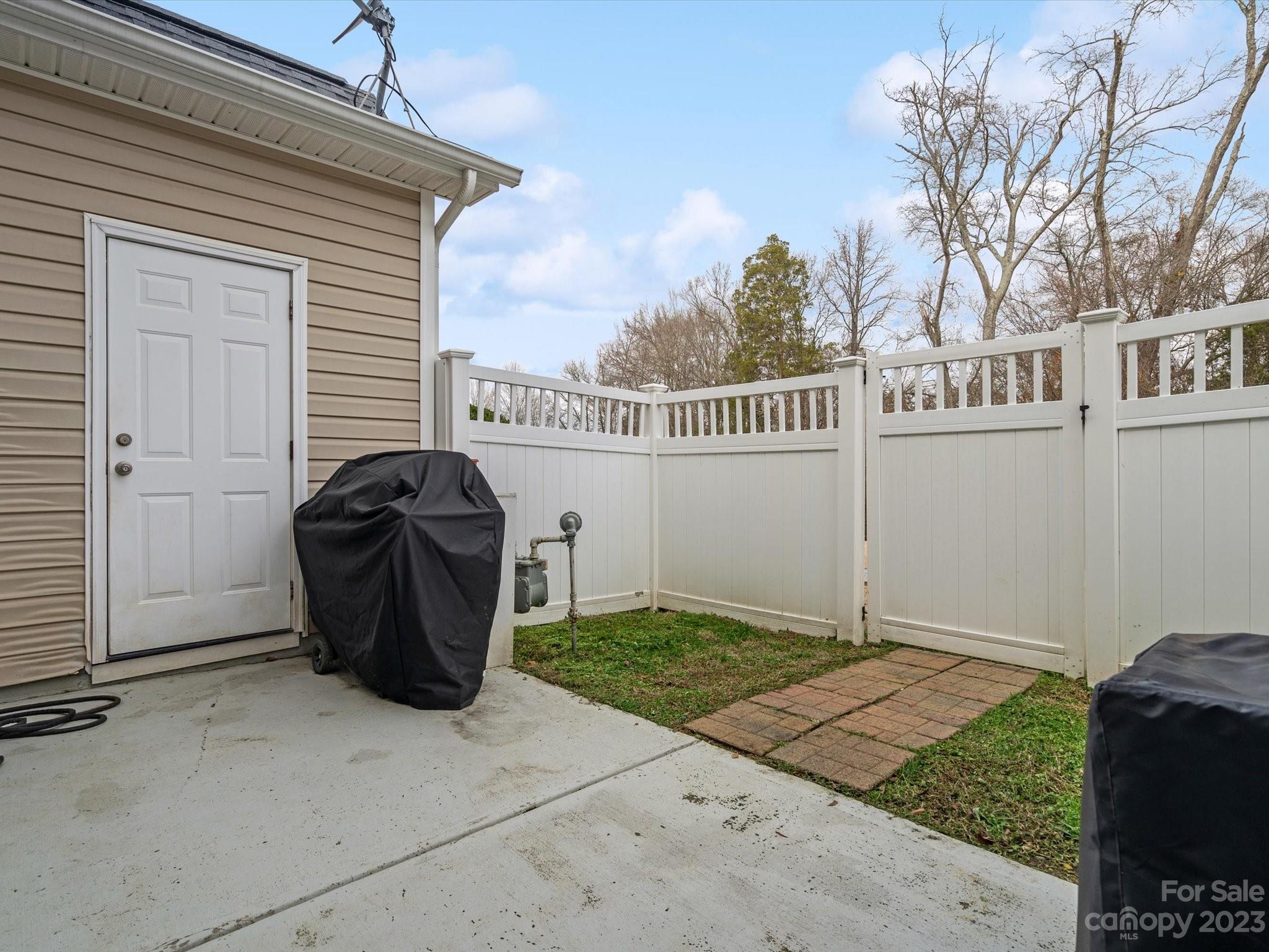 256 River Clay Road Fort Mill, SC 29708 - Photo 31 of 41 a view of a chair and table in backyard of the house