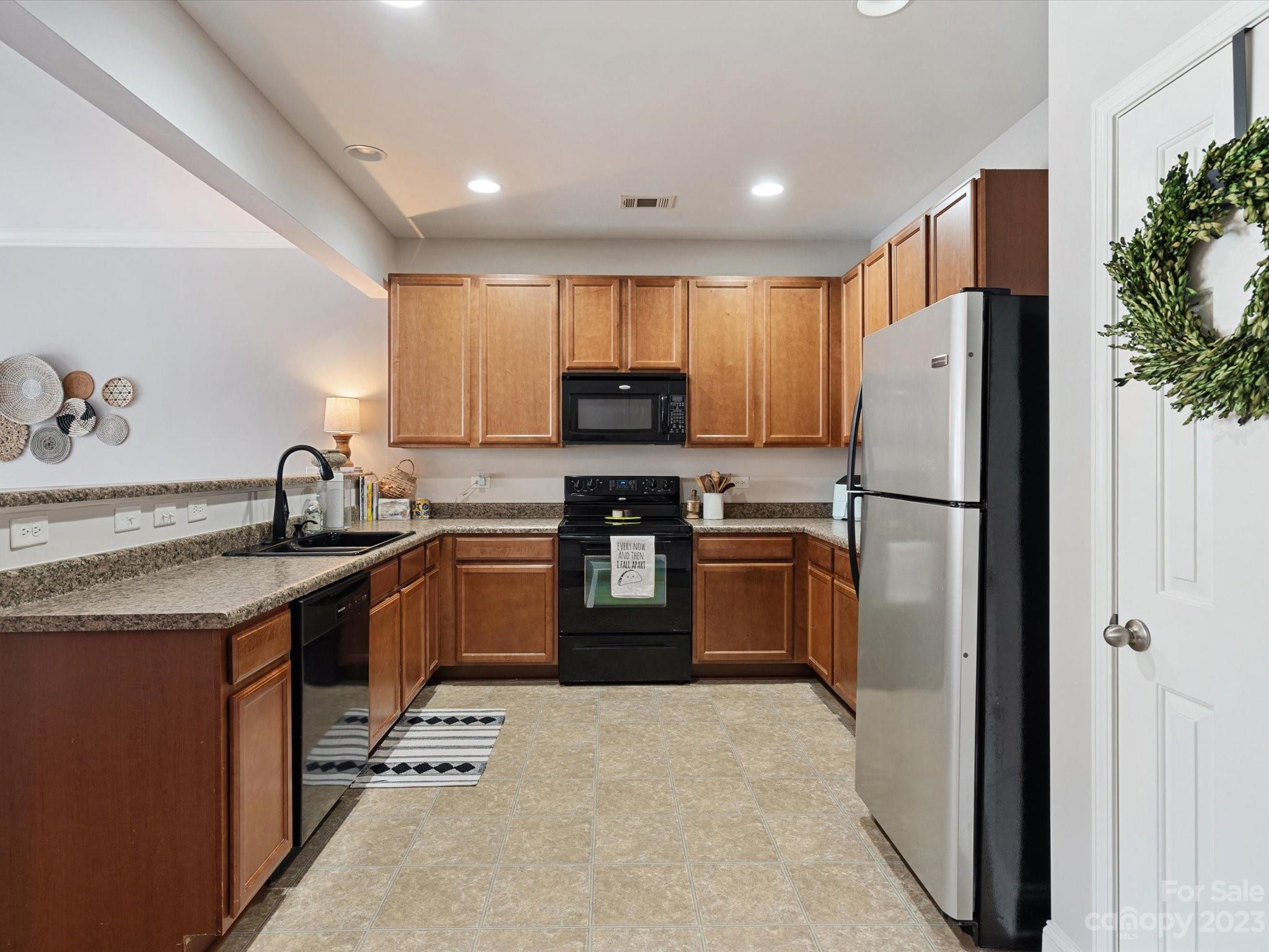 256 River Clay Road Fort Mill, SC 29708 - Photo 5 of 41 a kitchen with granite countertop a refrigerator stove and sink