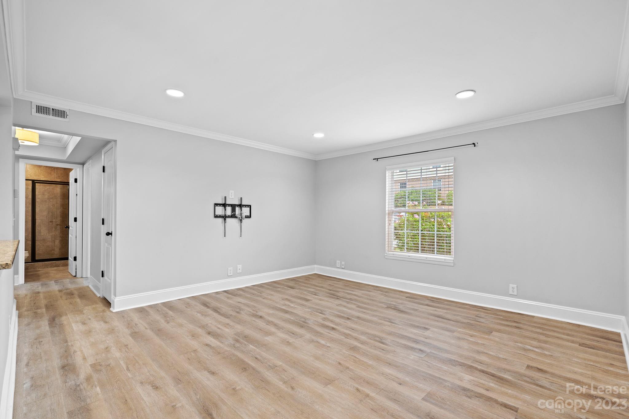 2614 Park Road Charlotte, NC 28209 - Photo 6 of 19 wooden floor in an empty room with a window