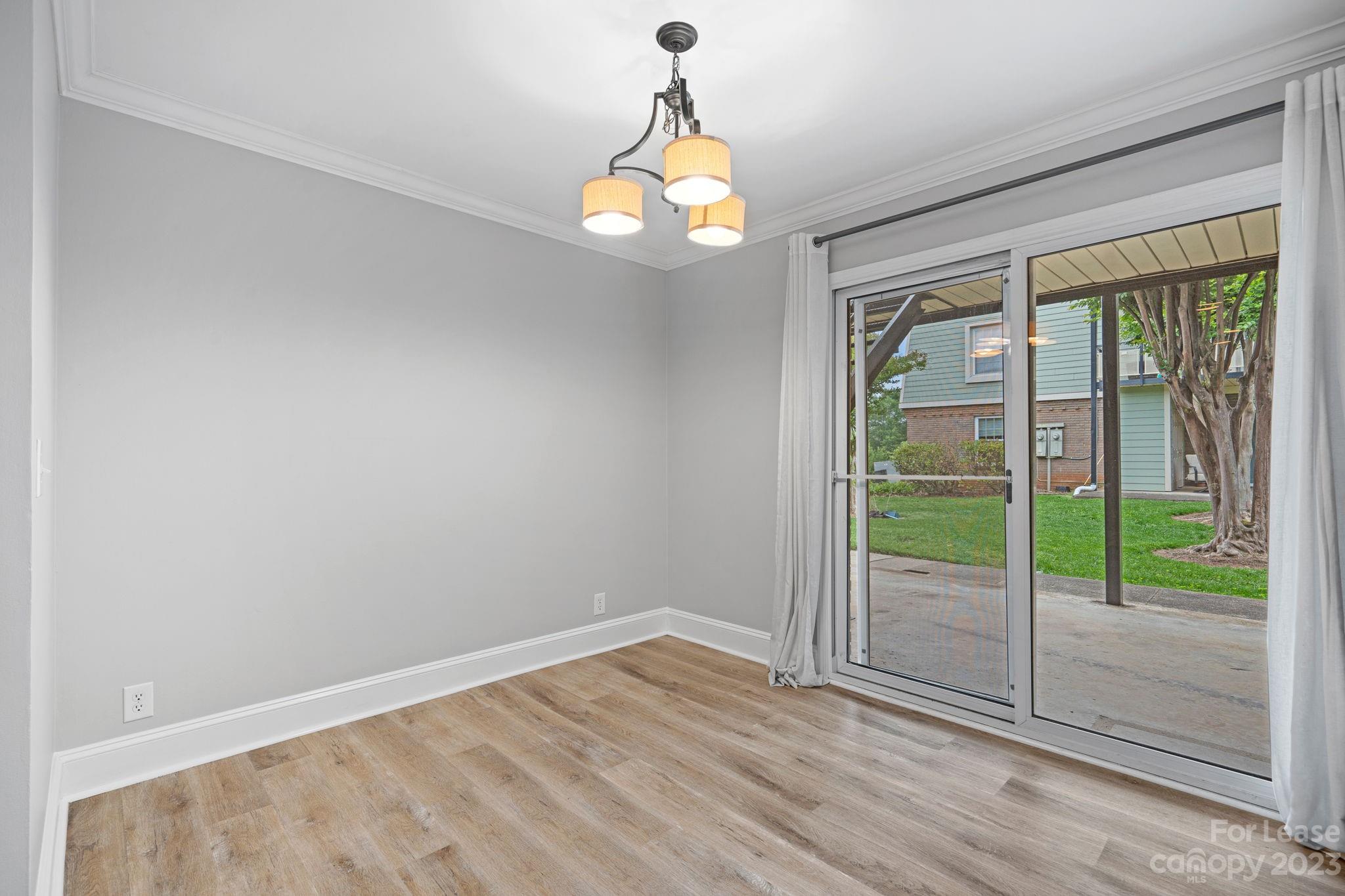 2614 Park Road Charlotte, NC 28209 - Photo 7 of 19 a very nice looking room with wooden floor fan and windows