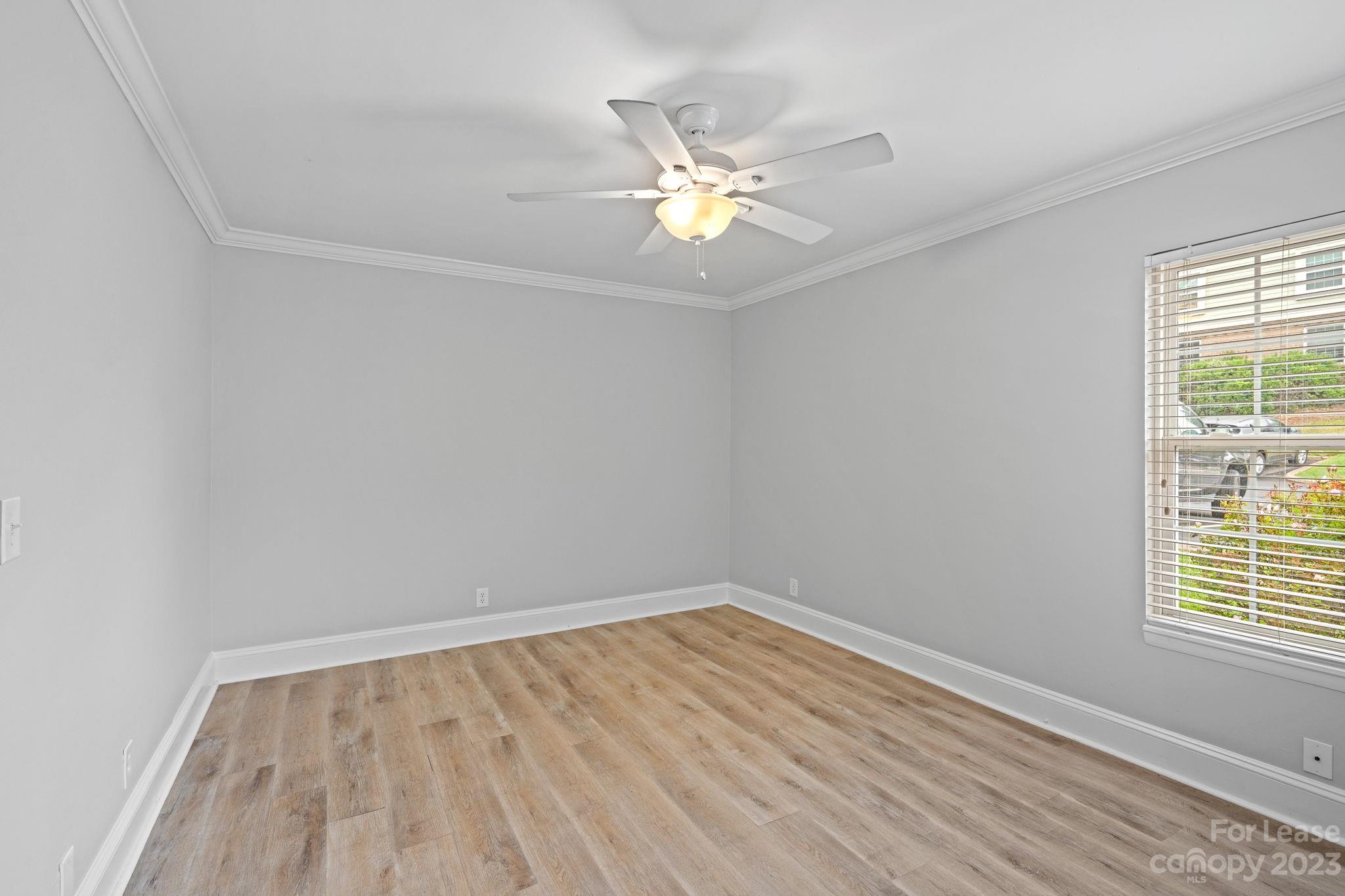 2614 Park Road Charlotte, NC 28209 - Photo 8 of 19 wooden floor in an empty room with a window