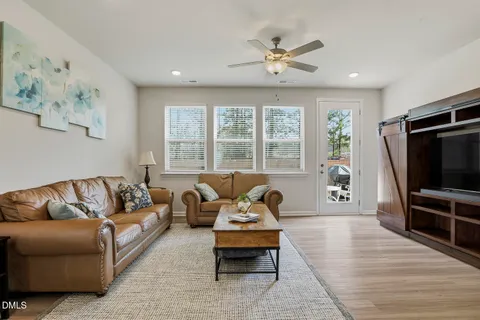 a kitchen with stainless steel appliances granite countertop a sink refrigerator and microwave