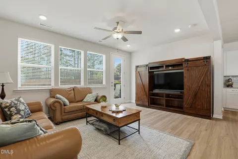 a kitchen with stainless steel appliances granite countertop a refrigerator a stove and a sink