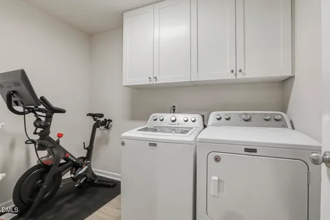 a white bath tub sitting next to a bathroom sink