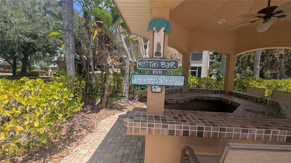 6552 Moorings Point Circle, Unit 102 Lakewood Ranch, FL 34202 - Photo 38 of 57 a front view of a house with a yard