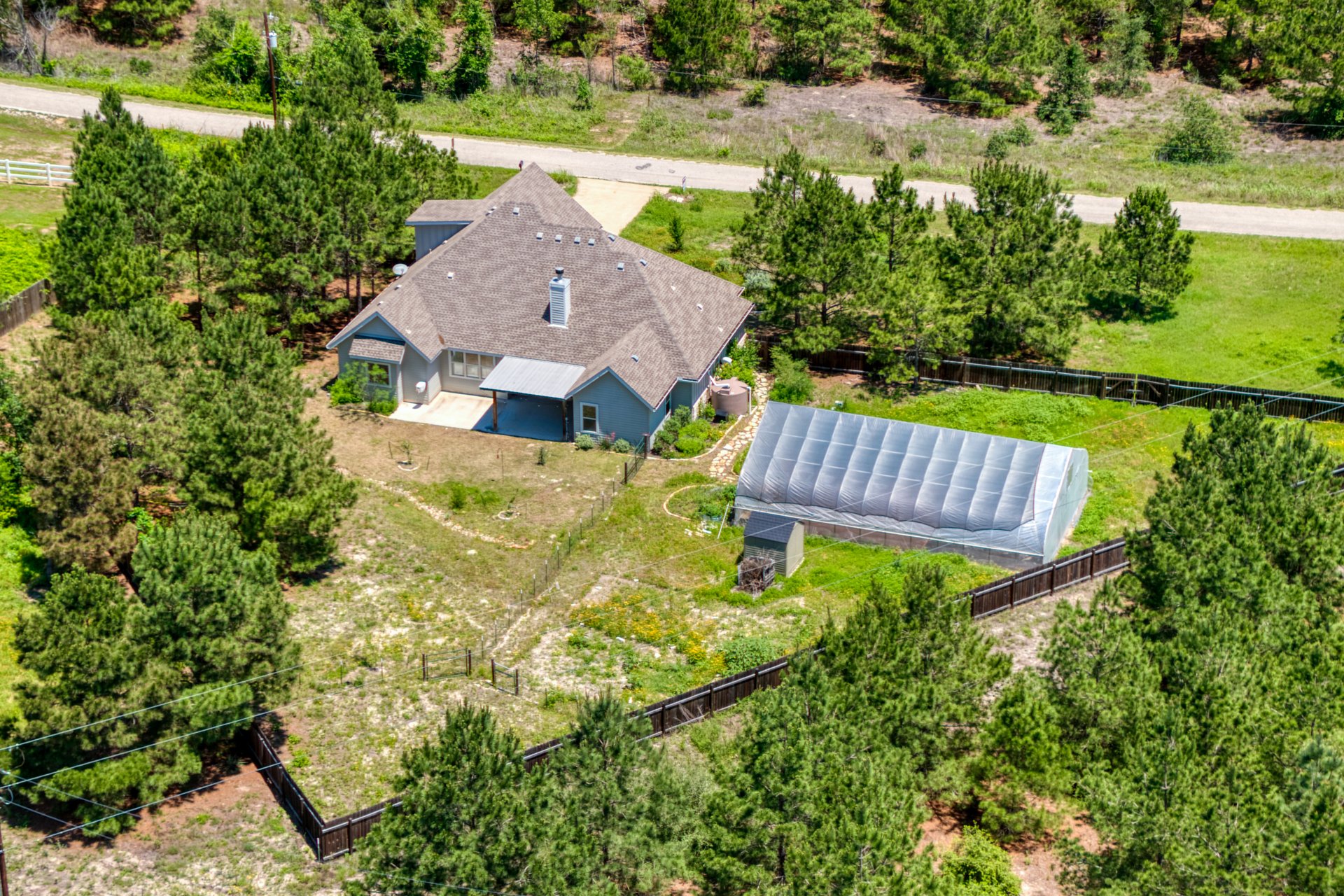 258 County Road Bastrop, TX 78602 - Photo 28 of 32 a view of a garden with swimming pool and outdoor seating