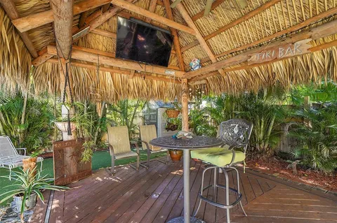 a view of a chairs and table in a backyard