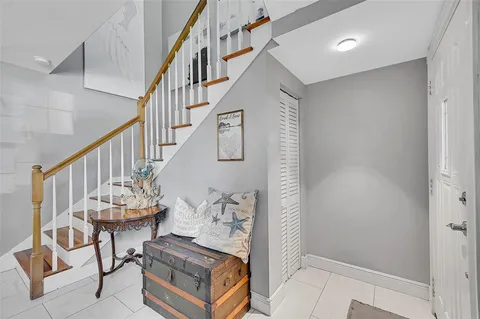 a view of an entryway and wooden floor