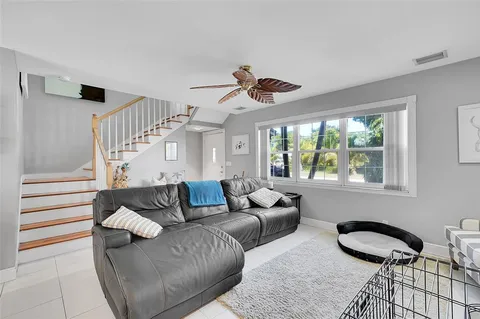 a living room with furniture and a window