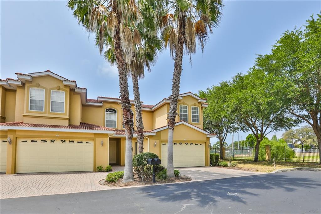 1466 Ribolla Drive Palm Harbor, FL 34683 - Photo 1 of 1 front view of a house with a garden