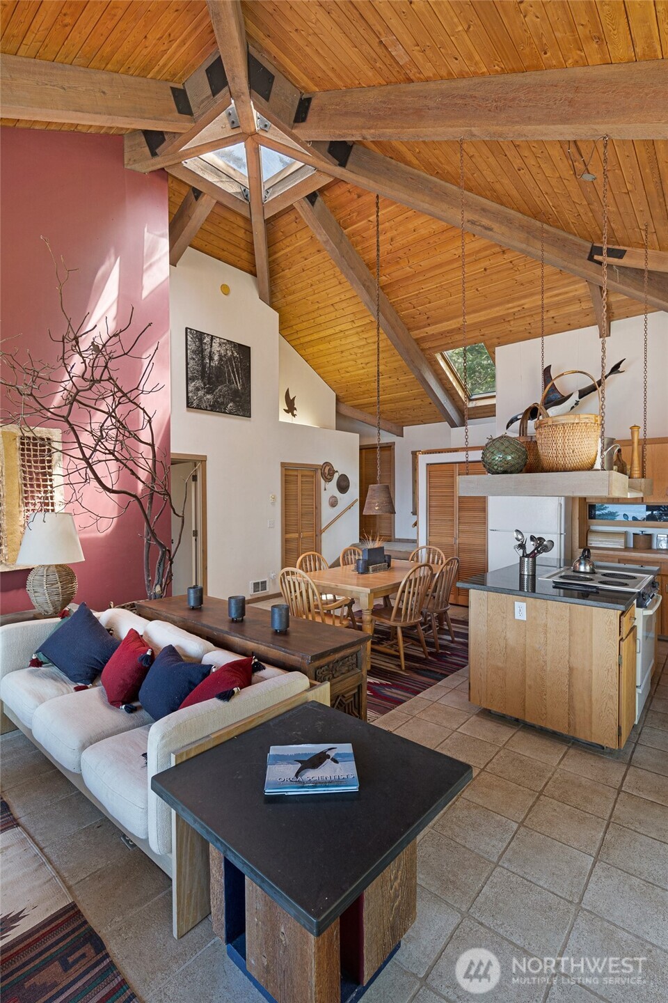 30 Smugglers Cove Road Friday Harbor, WA 98250 - Photo 21 of 39 a living room with furniture and a chandelier