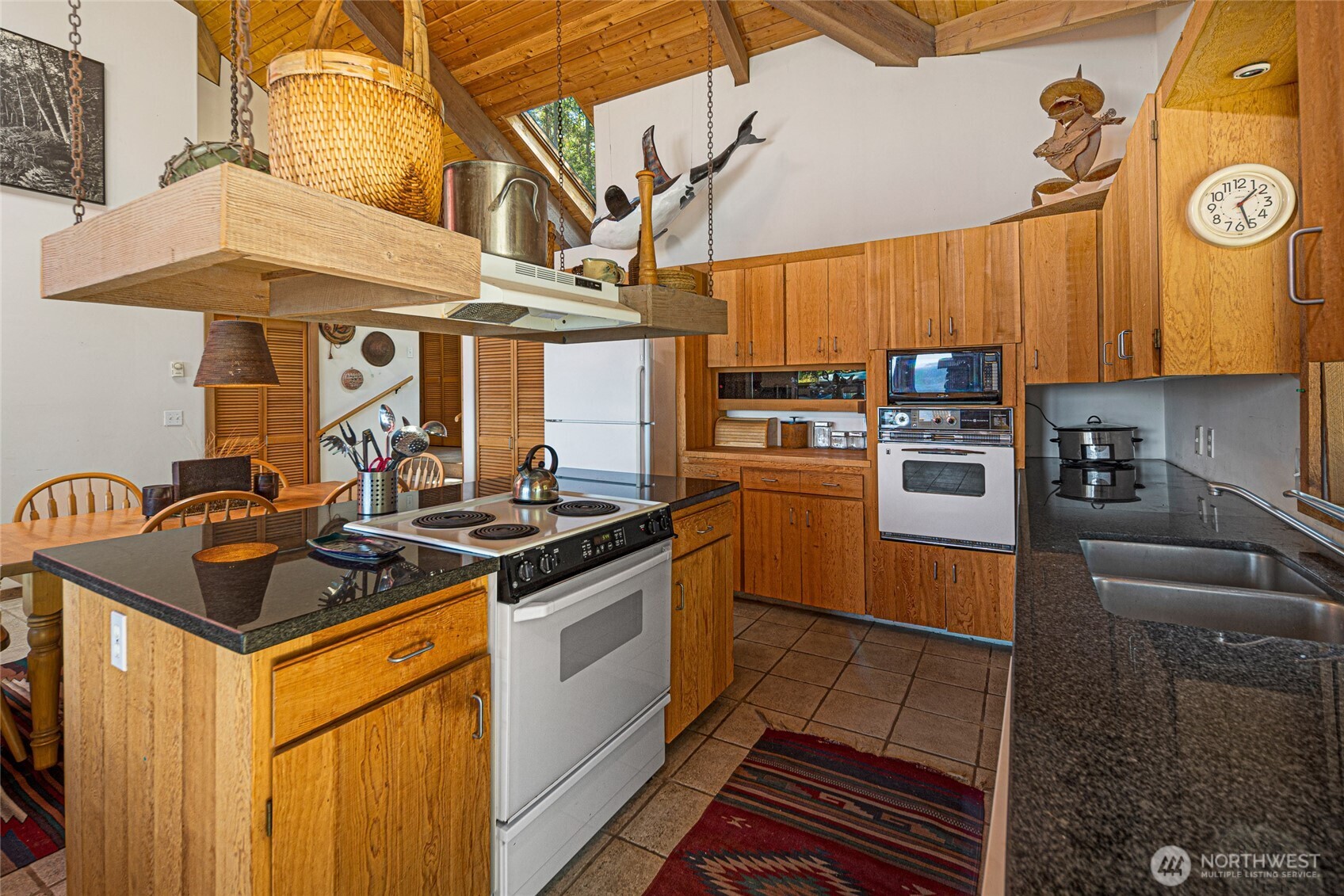30 Smugglers Cove Road Friday Harbor, WA 98250 - Photo 22 of 39 a kitchen with stainless steel appliances granite countertop a stove and a sink