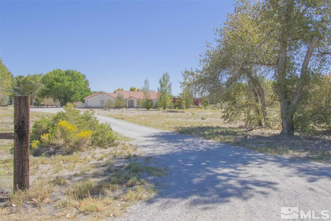 5141 Solias Road Fallon, NV 89406 - Photo 16 of 24 a view of a dirt road with a building in the background