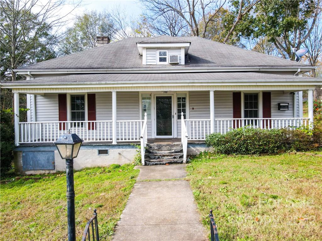 199 North Meridian Street Rutherfordton, NC 28139 - Photo 1 of 39 front view of a house with a yard and potted plants