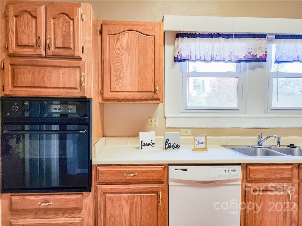 199 North Meridian Street Rutherfordton, NC 28139 - Photo 13 of 39 a kitchen with a sink cabinets and a window