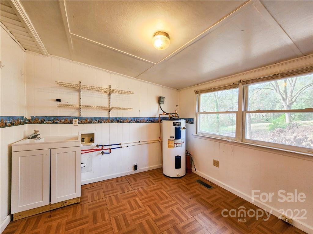 199 North Meridian Street Rutherfordton, NC 28139 - Photo 26 of 39 a kitchen with granite countertop a sink and a stove