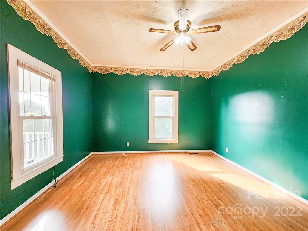 199 North Meridian Street Rutherfordton, NC 28139 - Photo 4 of 39 a bedroom with a bed and a large window