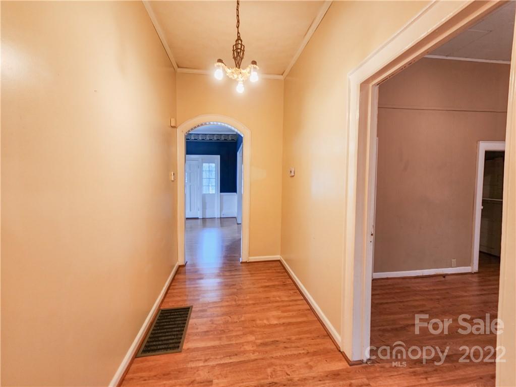 199 North Meridian Street Rutherfordton, NC 28139 - Photo 9 of 39 a view of a hallway with wooden floor