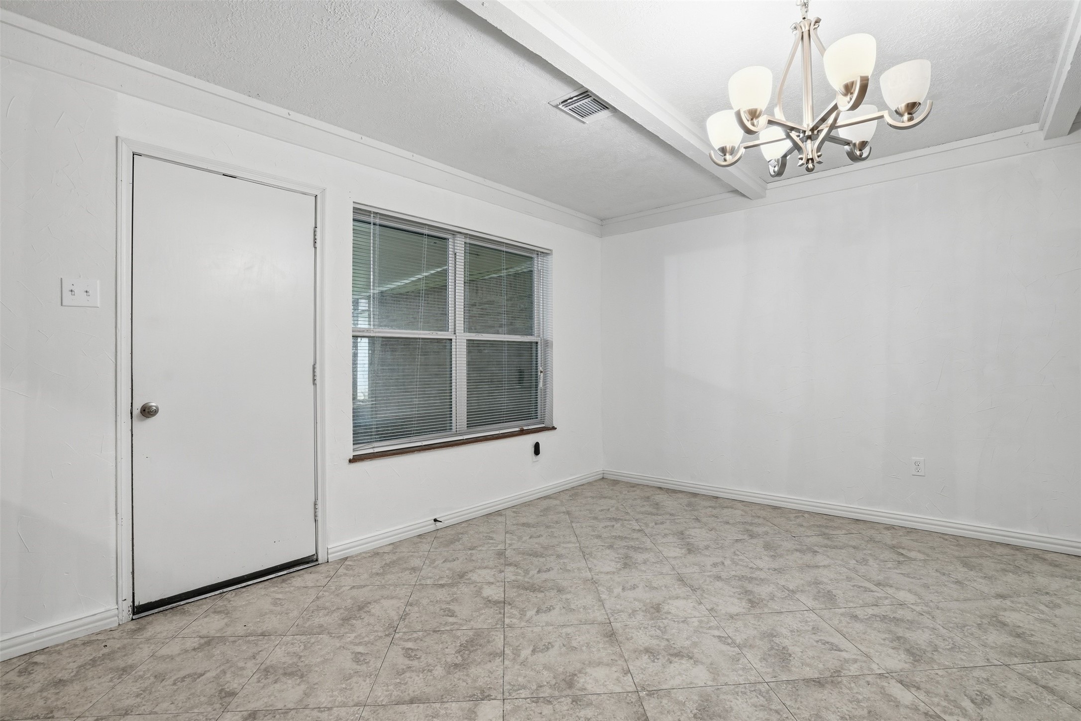 2605 Burke Road Pasadena, TX 77502 - Photo 10 of 29 a view of an empty room with a window