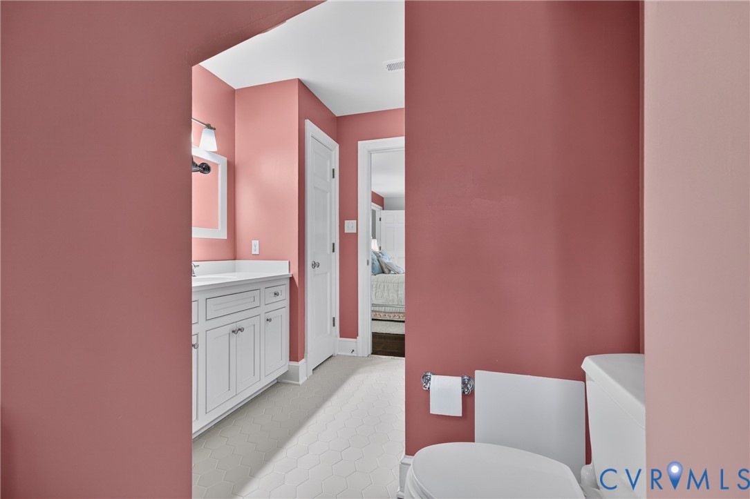 1108 Shallow Well Road Manakin-Sabot, VA 23103 - Photo 52 of 86 White hexagonal floor tile, white vanity with cabi
