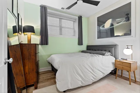 a bedroom with a bed and dresser