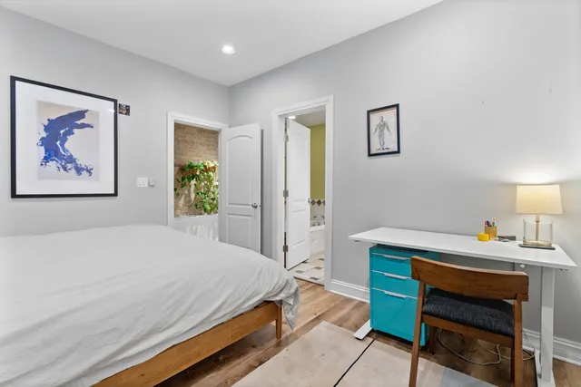 a bedroom with a bed and a table in it