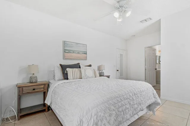 a large bed in a white room