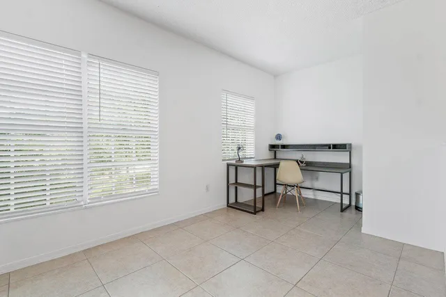 a workspace with furniture and a window